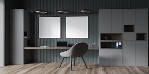 Two white boards on wall of home office with grey minimalist cabinet, green wall panels, three pendant lamps, niche desk, chair and wood floor. Concept of modern interior design. Mockup. 3d rendering